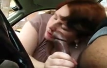Sucking a black cock in the car...